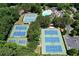 An aerial view of the community tennis courts, featuring multiple well-maintained blue tennis courts at 733 Vinings Estates Se Dr, Mableton, GA 30126