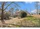 Picturesque backyard featuring a deck, pool, and lush surroundings, perfect for outdoor living at 2331 Rabbit Farm Cir, Loganville, GA 30052