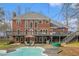 Backyard view of the pool and deck area, perfect for summer gatherings and outdoor enjoyment at 2331 Rabbit Farm Cir, Loganville, GA 30052