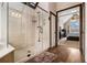 Modern bathroom with frameless glass shower and wood-look floors at 2331 Rabbit Farm Cir, Loganville, GA 30052