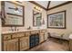 Well-lit bathroom featuring a double vanity, framed mirrors, and custom fixtures at 2331 Rabbit Farm Cir, Loganville, GA 30052