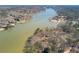 Scenic aerial view of a lakefront property surrounded by lush greenery at 2506 Emerald Dr, Jonesboro, GA 30236