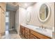 Bathroom with a double vanity and a large mirror above, offering a spacious feel at 2506 Emerald Dr, Jonesboro, GA 30236