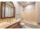 Traditional bathroom featuring a large framed mirror and marble countertops at 2506 Emerald Dr, Jonesboro, GA 30236