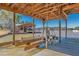 Covered boat dock featuring boat lift, wood decking and views of the lake at 2506 Emerald Dr, Jonesboro, GA 30236