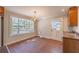 Bright dining room features brick floors, a large window, and a classic chandelier at 2506 Emerald Dr, Jonesboro, GA 30236