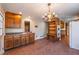 Kitchen featuring brick floors, built in shelving and oven, and wood cabinets at 2506 Emerald Dr, Jonesboro, GA 30236