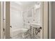 Classic white bathroom featuring subway tile, pedestal sink, and stylish fixtures at 630 Oakdale Ne Rd, Atlanta, GA 30307