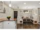 Sunlit breakfast nook featuring a built-in bench and a stylish modern light fixture at 630 Oakdale Ne Rd, Atlanta, GA 30307