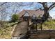 View of the Atlanta City Candler Park Golf Course with lush landscape and picturesque brick clubhouse with stairs at 630 Oakdale Ne Rd, Atlanta, GA 30307