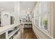 Hallway leading to the updated kitchen, featuring hardwood floors, and abundant natural light at 630 Oakdale Ne Rd, Atlanta, GA 30307