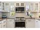 Close up of the updated kitchen boasting stainless steel oven and classic white cabinetry at 630 Oakdale Ne Rd, Atlanta, GA 30307