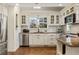 Well-lit kitchen boasts stainless steel appliances and timeless white cabinetry at 630 Oakdale Ne Rd, Atlanta, GA 30307