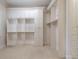 Large walk-in closet with custom built-in shelving and drawers for optimal organization at 185 Windsor Cv, Sandy Springs, GA 30328