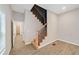 Bright entryway features wood-look floors and a staircase with black iron balusters at 962 Welch Sw St, Atlanta, GA 30310