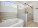 Beautiful bathroom featuring walk-in shower with glass doors, and soaker tub at 1809 Hanwoo Ln, Powder Springs, GA 30127