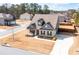 Aerial view of a well-kept home with mature trees, backyard fence and long driveway at 1809 Hanwoo Ln, Powder Springs, GA 30127