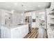 Kitchen with white cabinets, island with seating and stainless steel appliances at 1809 Hanwoo Ln, Powder Springs, GA 30127