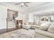 Comfortable living room with a staircase and an open view into the modern kitchen at 1809 Hanwoo Ln, Powder Springs, GA 30127