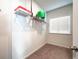 Carpeted storage area features a wire rack shelf and a window for natural light at 1809 Hanwoo Ln, Powder Springs, GA 30127