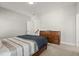 Neutral bedroom with striped bedding, a wooden dresser and carpeted floors at 2005 Haley Wlk Walk, Woodstock, GA 30188