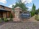 Oakhurst Brock Built community sign with stone and brick accents, landscaped surroundings at 2005 Haley Wlk Walk, Woodstock, GA 30188