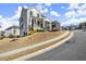 Street view of a home on a beautifully landscaped lot with sidewalks at 2005 Haley Wlk Walk, Woodstock, GA 30188