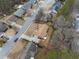 Aerial view of a residential neighborhood with mature trees and well-maintained homes at 2895 Dogwood Creek Pkwy, Duluth, GA 30096