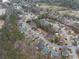 Aerial view of a residential neighborhood surrounded by lush greenery and mature trees at 2895 Dogwood Creek Pkwy, Duluth, GA 30096