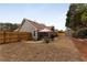 Fenced backyard features a storage shed, patio area, and a well-maintained lawn, great for outdoor living at 2895 Dogwood Creek Pkwy, Duluth, GA 30096