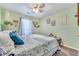 Bright bedroom with a ceiling fan and a picturesque window at 2895 Dogwood Creek Pkwy, Duluth, GA 30096