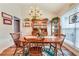 Cozy dining area with hardwood floors, a chandelier, and views of the backyard at 2895 Dogwood Creek Pkwy, Duluth, GA 30096