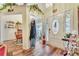 Welcoming foyer featuring a stylish door with stained glass and views into the dining room at 2895 Dogwood Creek Pkwy, Duluth, GA 30096