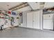 Spacious garage with epoxy floors, storage, and a refrigerator offers ample room for vehicles and projects at 2895 Dogwood Creek Pkwy, Duluth, GA 30096