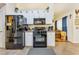 Kitchen featuring white cabinets, black appliances and eat-in breakfast area at 2895 Dogwood Creek Pkwy, Duluth, GA 30096