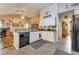 Bright kitchen features granite counters, white cabinets, and black appliances at 2895 Dogwood Creek Pkwy, Duluth, GA 30096