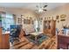 Spacious living room features hardwood floors, a ceiling fan, and lots of character at 2895 Dogwood Creek Pkwy, Duluth, GA 30096