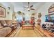 Bright living room boasting hardwood floors, a ceiling fan, and decorative accents at 2895 Dogwood Creek Pkwy, Duluth, GA 30096