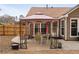 Cozy outdoor patio features a dining set under a canopy, perfect for al fresco dining at 2895 Dogwood Creek Pkwy, Duluth, GA 30096