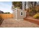 The backyard features a storage shed with a window and adjacent garden bed, ideal for extra storage at 2895 Dogwood Creek Pkwy, Duluth, GA 30096