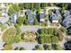 Stunning aerial view of the neighborhood showcasing manicured lawns and mature trees at 3786 Turnberry Ct, Duluth, GA 30096