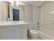 Clean bathroom featuring a toilet, vanity and shower with white tile at 3786 Turnberry Ct, Duluth, GA 30096