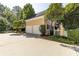 Detached two car garage on a sunny day with trees at 3786 Turnberry Ct, Duluth, GA 30096