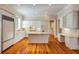 Spacious kitchen featuring white cabinets, granite countertops, and stainless steel appliances at 3786 Turnberry Ct, Duluth, GA 30096