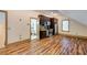 Kitchen with modern appliances, dark cabinets, and wood floors next to a bath at 3786 Turnberry Ct, Duluth, GA 30096