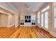 Bright living room features hardwood floors, built-in shelving, white columns, and access to backyard at 3786 Turnberry Ct, Duluth, GA 30096