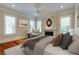 Relaxing main bedroom featuring hardwood floors, a fireplace, and natural light at 3786 Turnberry Ct, Duluth, GA 30096