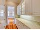 Pantry with marble countertops and decorative molding with white cabinets at 3786 Turnberry Ct, Duluth, GA 30096