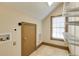 Room with a window, shelves, tile floor and a door at 3786 Turnberry Ct, Duluth, GA 30096