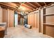 Unfinished basement space with exposed beams and the mechanical components visible at 4446 Frontier Way, Sugar Hill, GA 30518